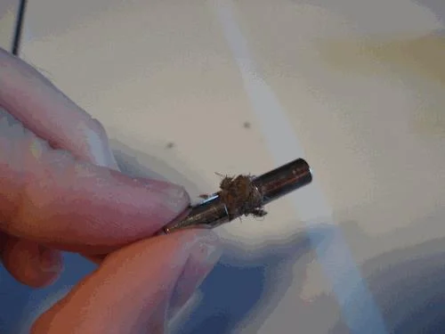 Pulizia dell'asta di metallo