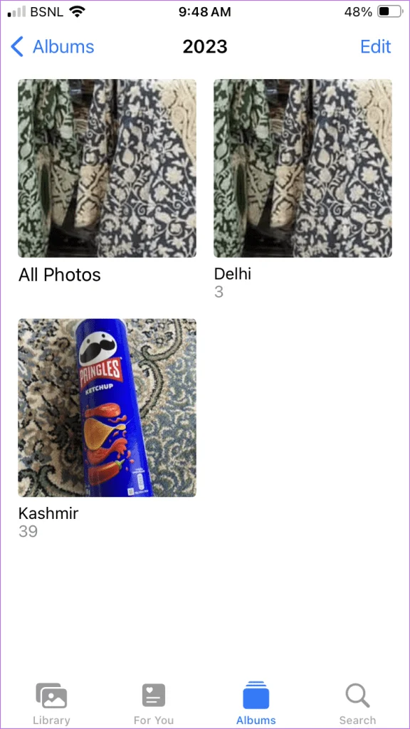 Quelle est la différence entre un album et un dossier dans Photos